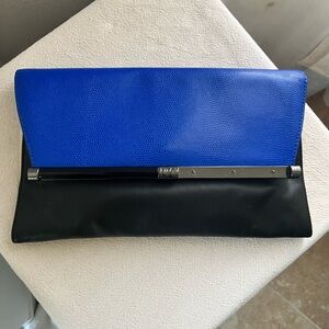 Diane von Furstenberg Envelope Clutch in
Embossed Black Leather